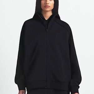 SKIMS Nike black matte zip up.